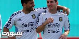 Argentina's national football forward Lionel Messi (R) talks with teammate forward Sergio Aguero during a training session in Ezeiza, Buenos Aires, on September 6, 2013. Argentina will face Paraguay on September 10 in Asuncion in a Brazil 2014 FIFA World Cup South American qualifier match. AFP PHOTO / DANIEL GARCIA (Photo credit should read DANIEL GARCIA/AFP/Getty Images)