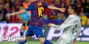Barcelona's Argentinian forward Lionel Messi (L) scores a goal as he vies with Real Madrid's Portuguese forward Cristiano Ronaldo during the second leg of the Spanish Supercup football match FC Barcelona vs Real Madrid CF on August 17, 2011 at the Camp Nou stadium in Barcelona. AFP PHOTO/ LLUIS GENE (Photo credit should read LLUIS GENE/AFP/Getty Images)